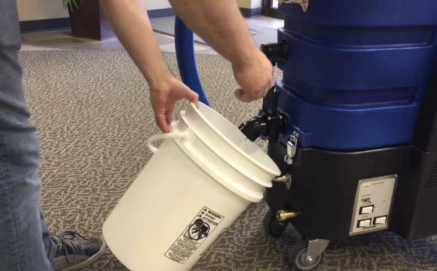 Floodmaster being emptied into bucket