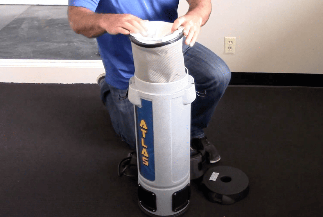 Filter being applied by a contractor to the commercial backpack vacuum