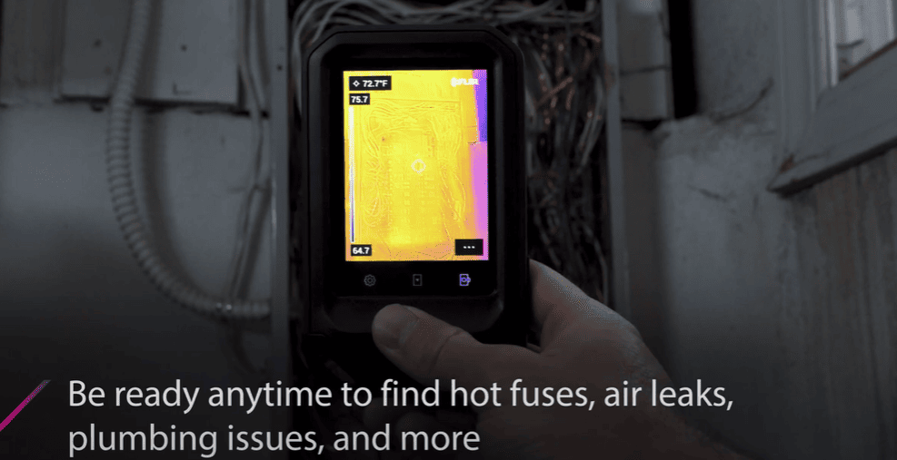 Flir C5 Thermal imaging device held by a hand with text overlay