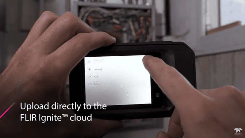 Person using a smartphone with FLIR C5Ignite cloud text overlay