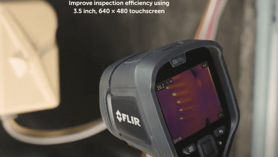 FLIR e6 thermal imaging device with touchscreen interface on a blurred background
