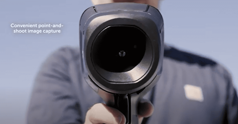 Person holding a flir e6 with a blurred background