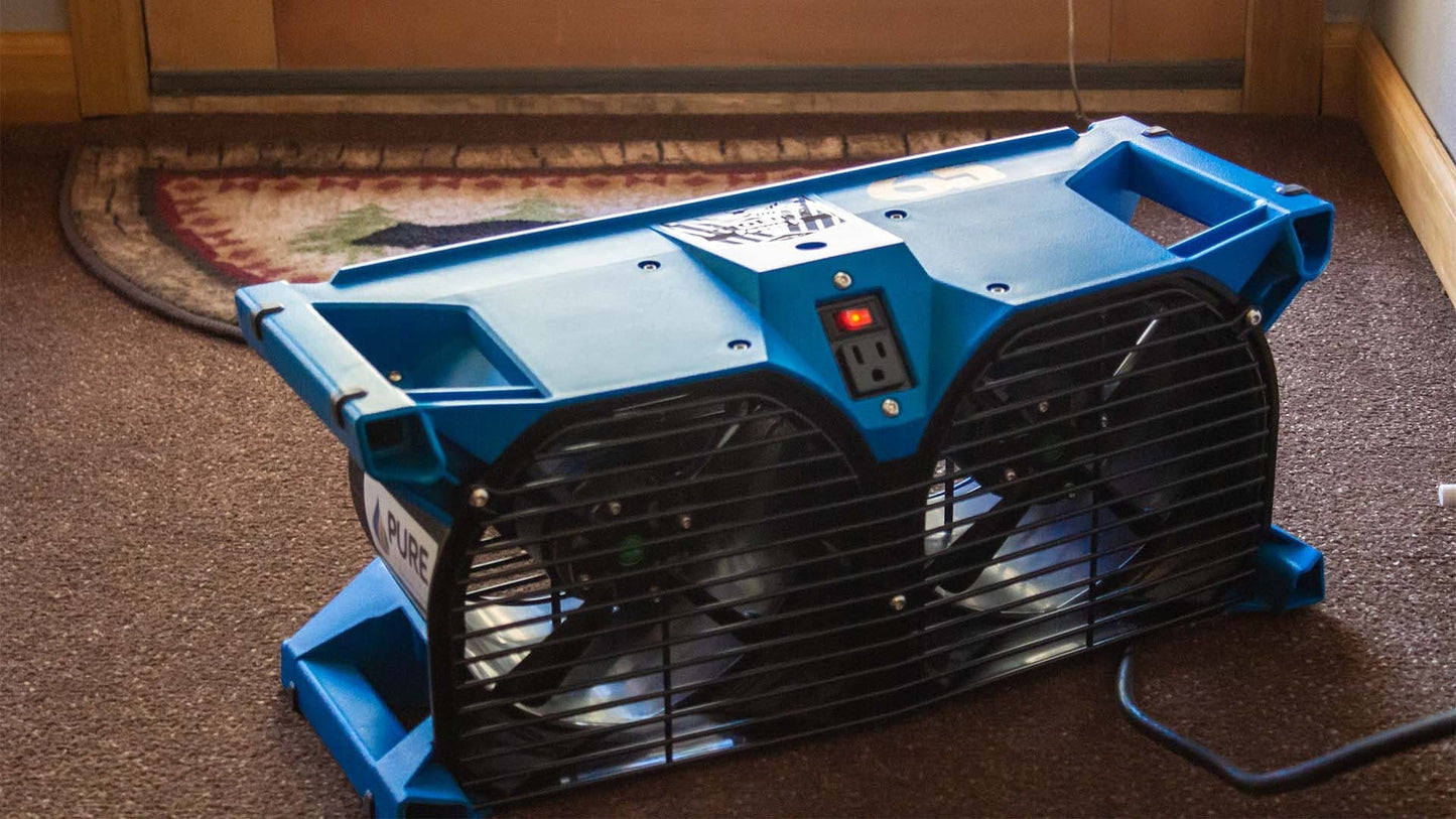 Blue Phoenix Focus II Dual Axial Air Mover on a carpeted floor
