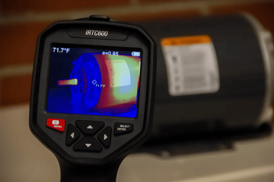 IRTC600 Infrared camera with thermal imaging display on a blurred background