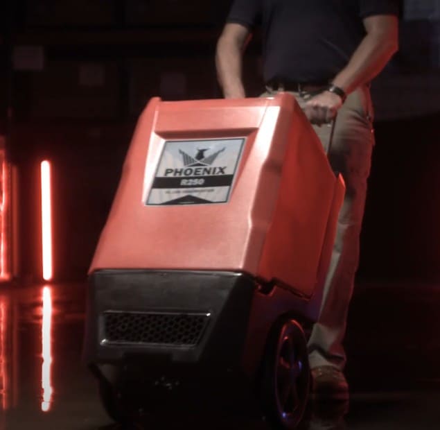 Phoenix R250 LGR Dehumidifier being pushed on wheels