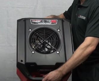 Person holding a Phoenix AirMax Radial Air Mover showing the top view