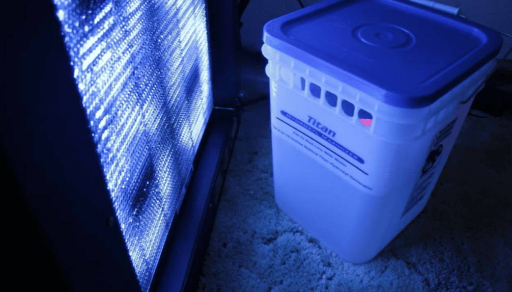Titan 4000 Max with Maximizer labeled 'Titan' on a dark floor.
