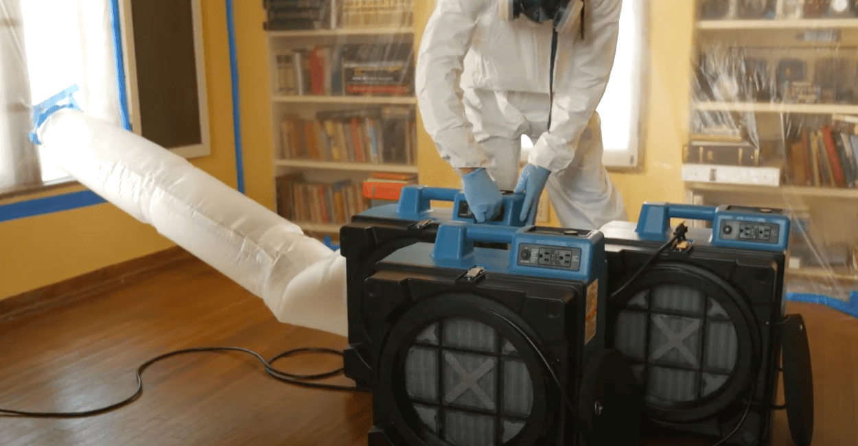 contractor using xpower x-3400a to clean pollutants and air in the room