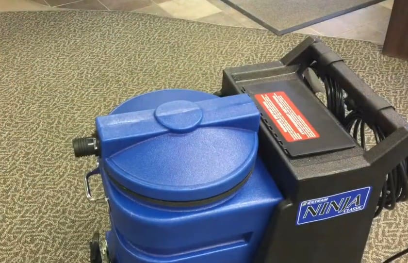 esteam ninja 500 psi Blue and black machine on a textured carpet