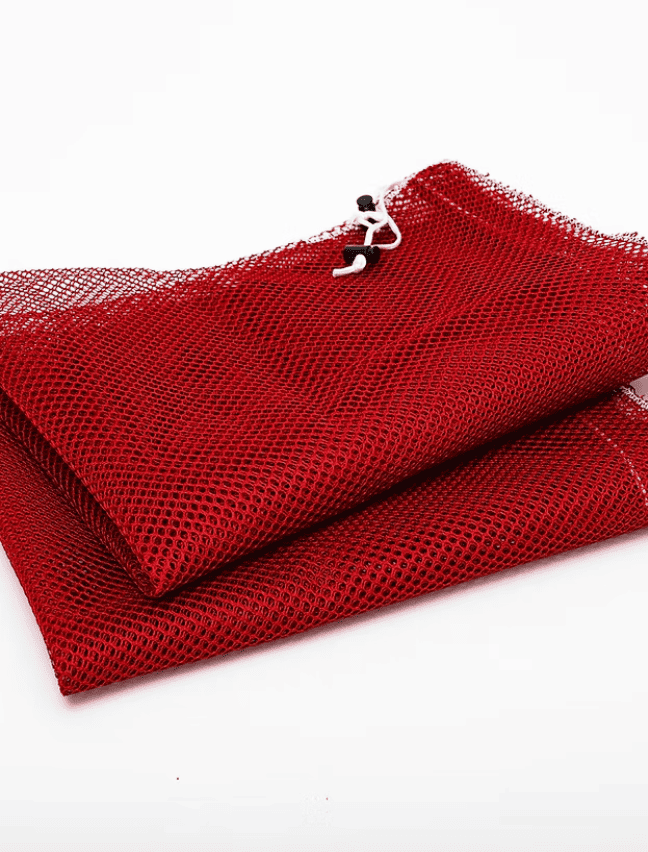 Red mesh pouch with a metal clasp on a white background
