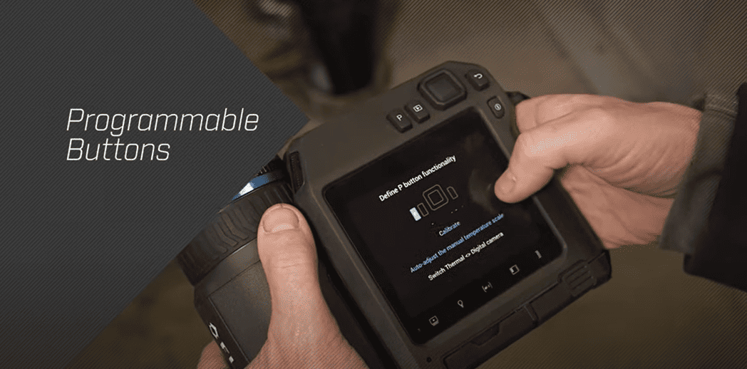 Person holding a t530 flir with programmable buttons and screen interface.