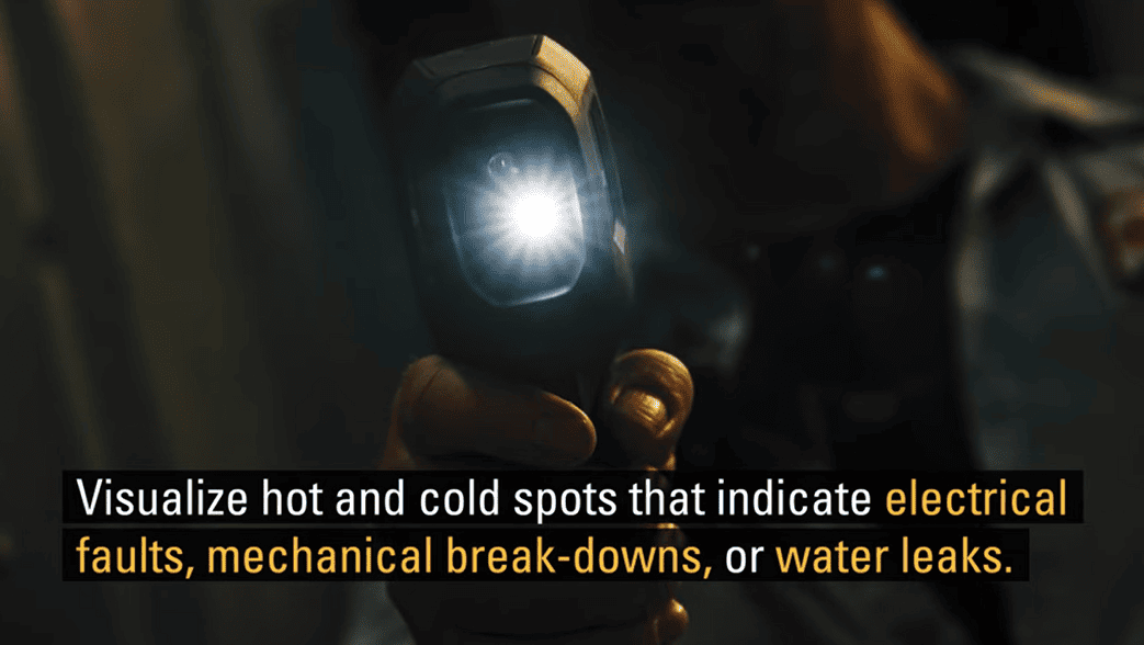 Hand holding aflir tg165 x with text about detecting electrical faults and leaks.