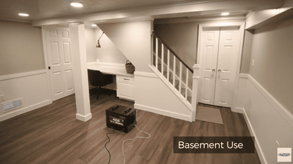 Basement interior with a desk, staircase, and cabinets with a Sentinel HDi65S Conventional Dehumidifier