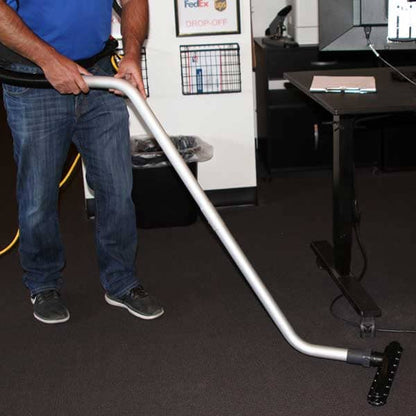 Contractor using atlas backpack on a carpet
