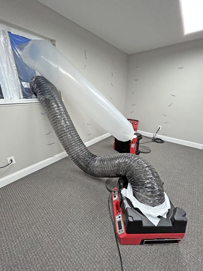 Phoenix Guardian R HEPA Air Scrubber on carpet with ducts connected