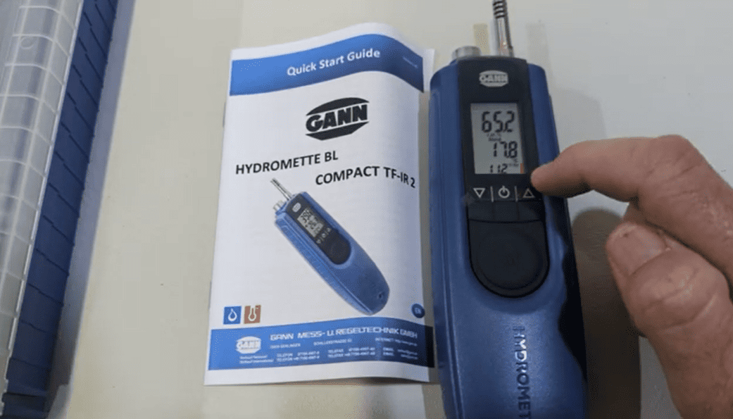 Hydromette BL Compact TF-IR 2 device with a quick start guide on a white surface.