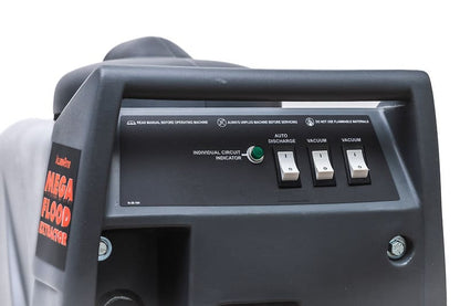 Control panel of a Mega Flood Extractor machine with switches and indicators.