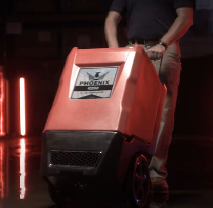Phoenix R250 LGR Dehumidifier being pushed on wheels