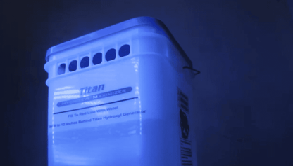 Titan Maximizer Blue-lit container with 'Titan' branding on a dark background