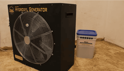 Titan 4000 Hydroxyl generator with a fan on a concrete floor next to a Maximizer