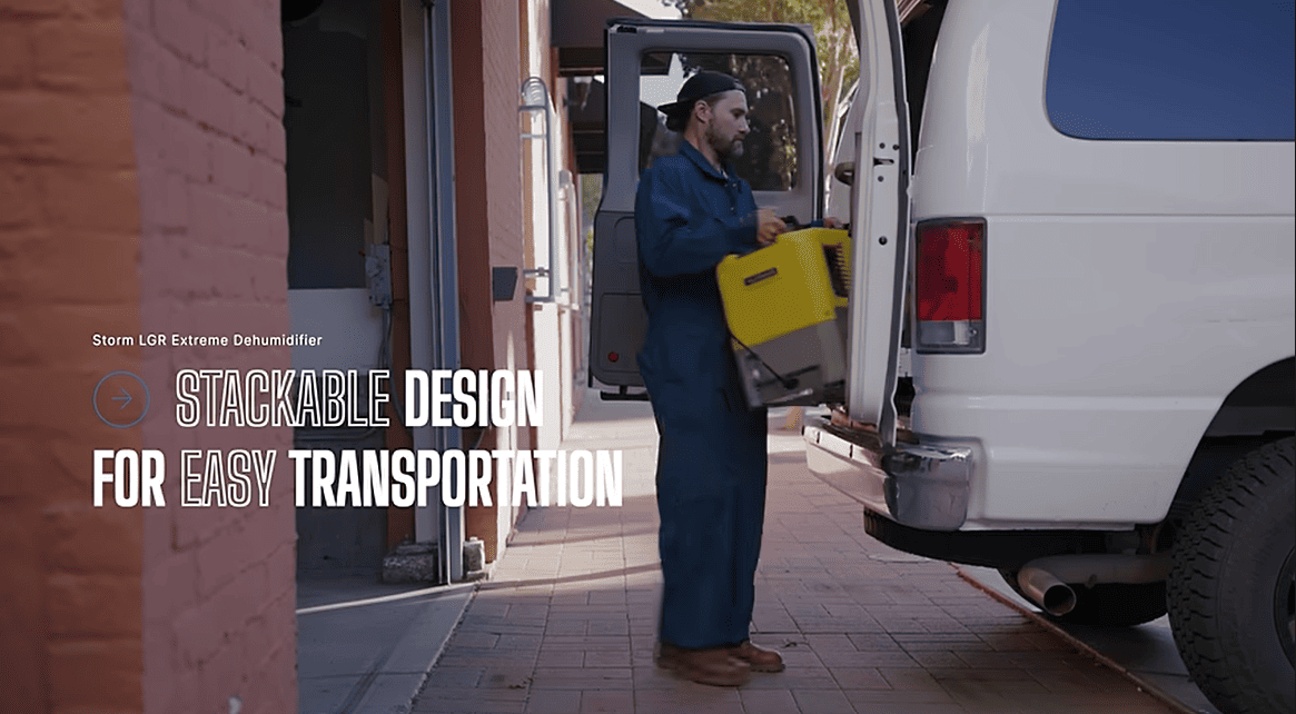 Person loading a yellow stackable alorair storm lgr extreme dehumidifier into a white van with text about stackable design.