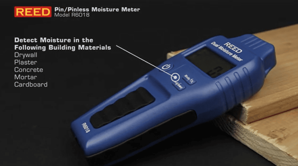 Blue REED r6018 Pin/Pinless Moisture Meter on a wooden surface with text indicating its use.