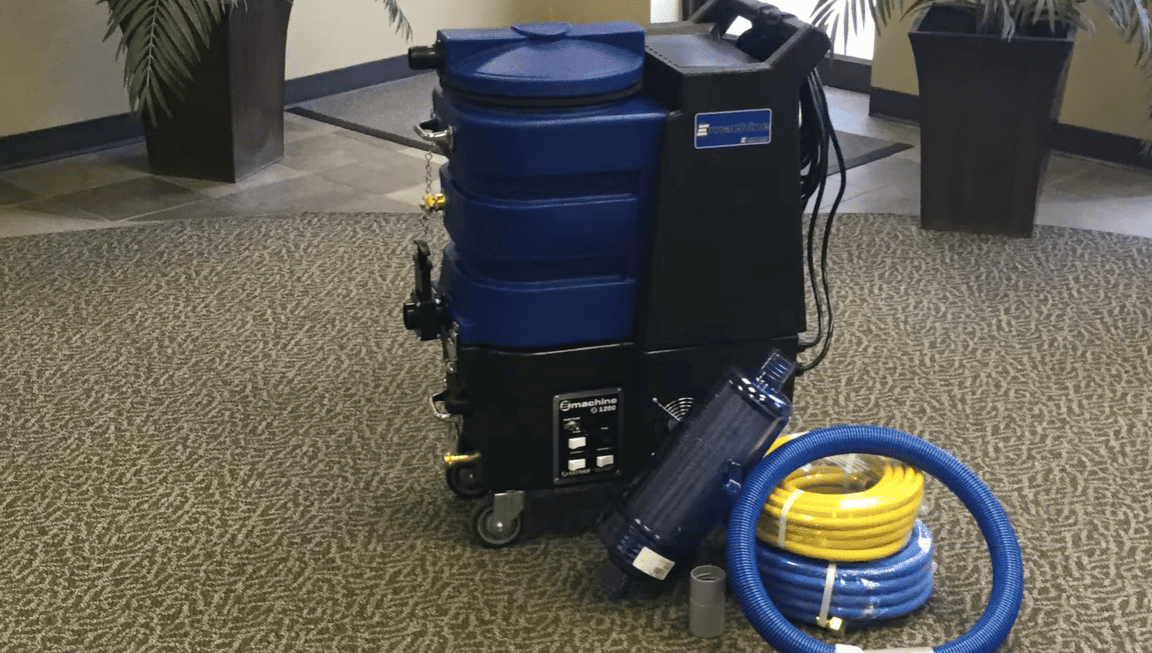 Commercial  esteam e1200 cleaning machine with hose on a carpeted floor