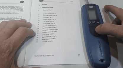 gann hydromette bl compact b Hygrometer being used checking settings on a document