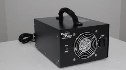 Black total zone tz 1 ozone generator facing right on a white surface