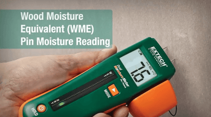 Extech mo260 digital moisture meter displaying a wood moisture equivalent reading on a neutral background