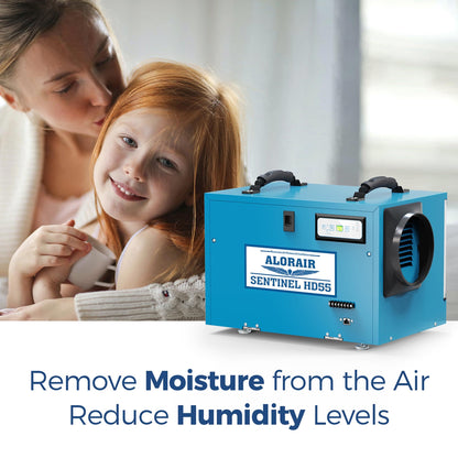 Woman and child with a blue sentinel hd55dehumidifier, text 'Remove Moisture from the Air Reduce Humidity Levels