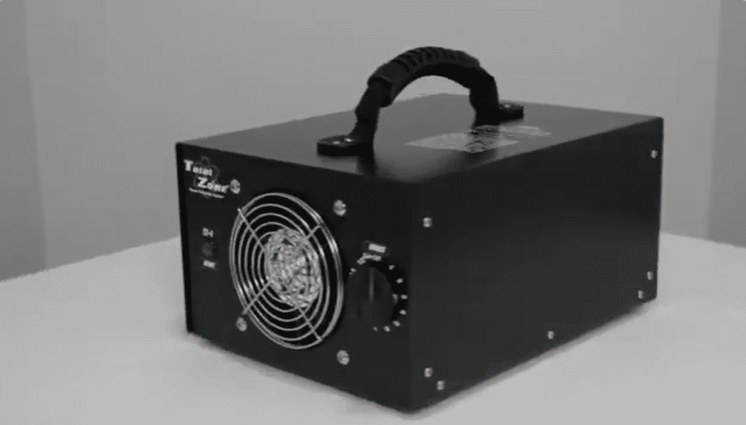 Black total zone tz 1 ozone generator side view left facing on a white surface