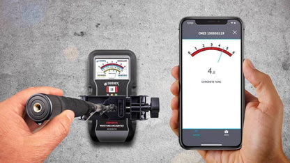 Handheld device tramex x5 with digital display and smartphone app on a gray background