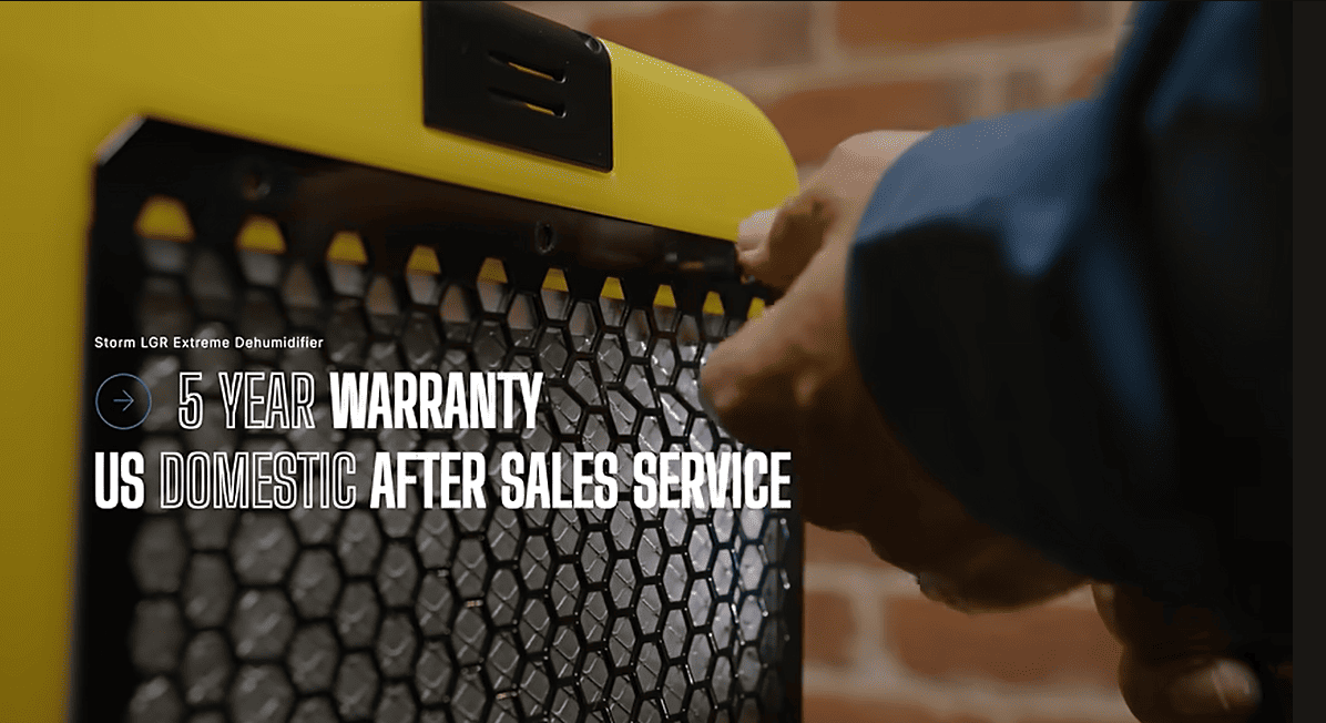 Close-up of a yellow and black alorair storm lgr extreme dehumidifier with text about warranty and after-sales service.