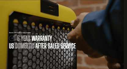 Close-up of a yellow and black alorair storm lgr extreme dehumidifier with text about warranty and after-sales service.